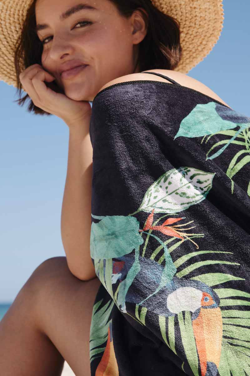 close up of woman wrapped in the toucan towel