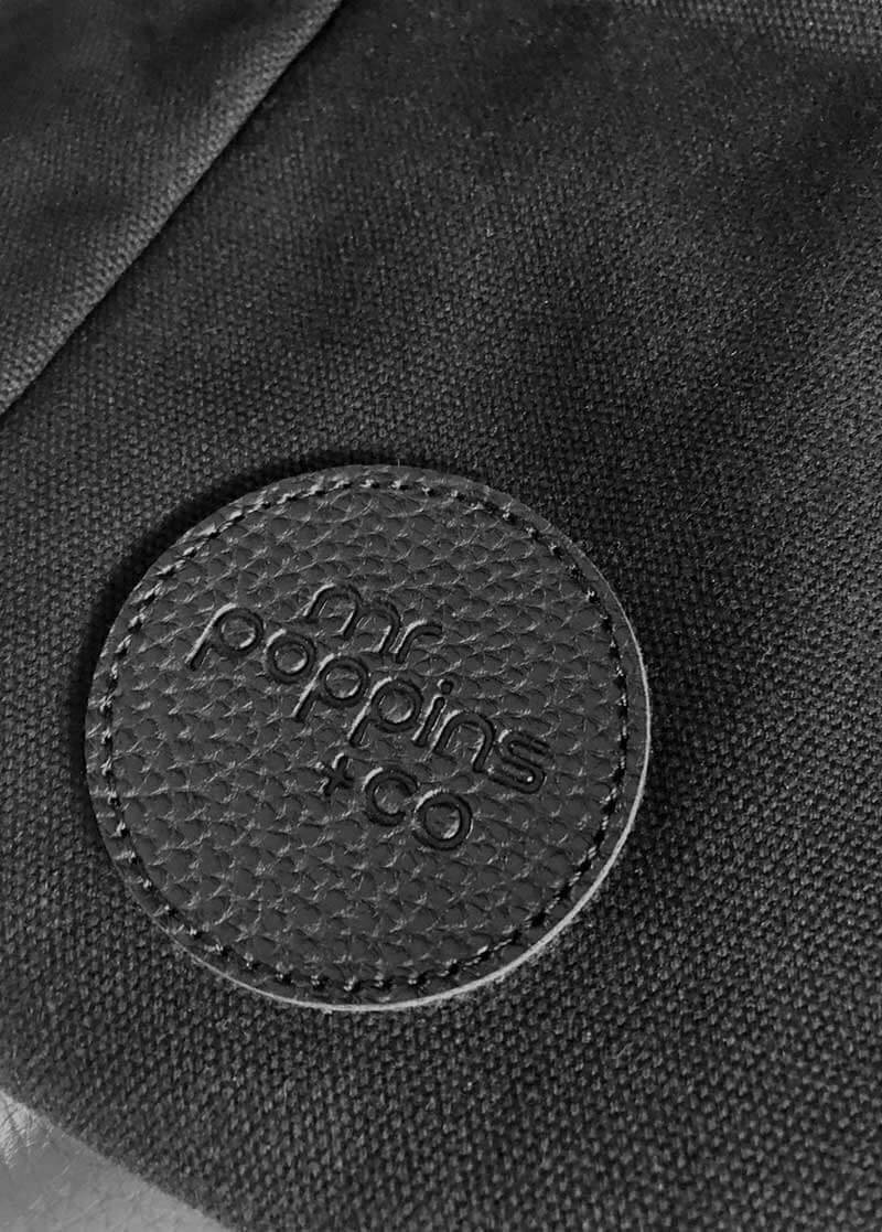 close up on embossed logo of front of Leisure Bag