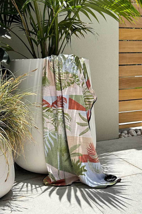 luxurious designer sand free towel draped over a pot plant 