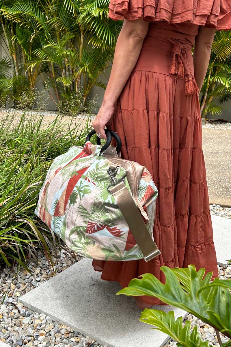 Palm springs carry-on bag in a woman&#39;s hand