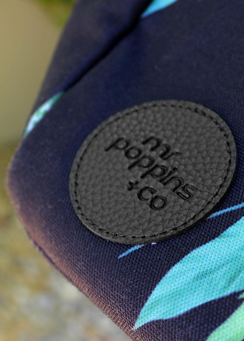 close up on embossed logo of front of Leisure Bag