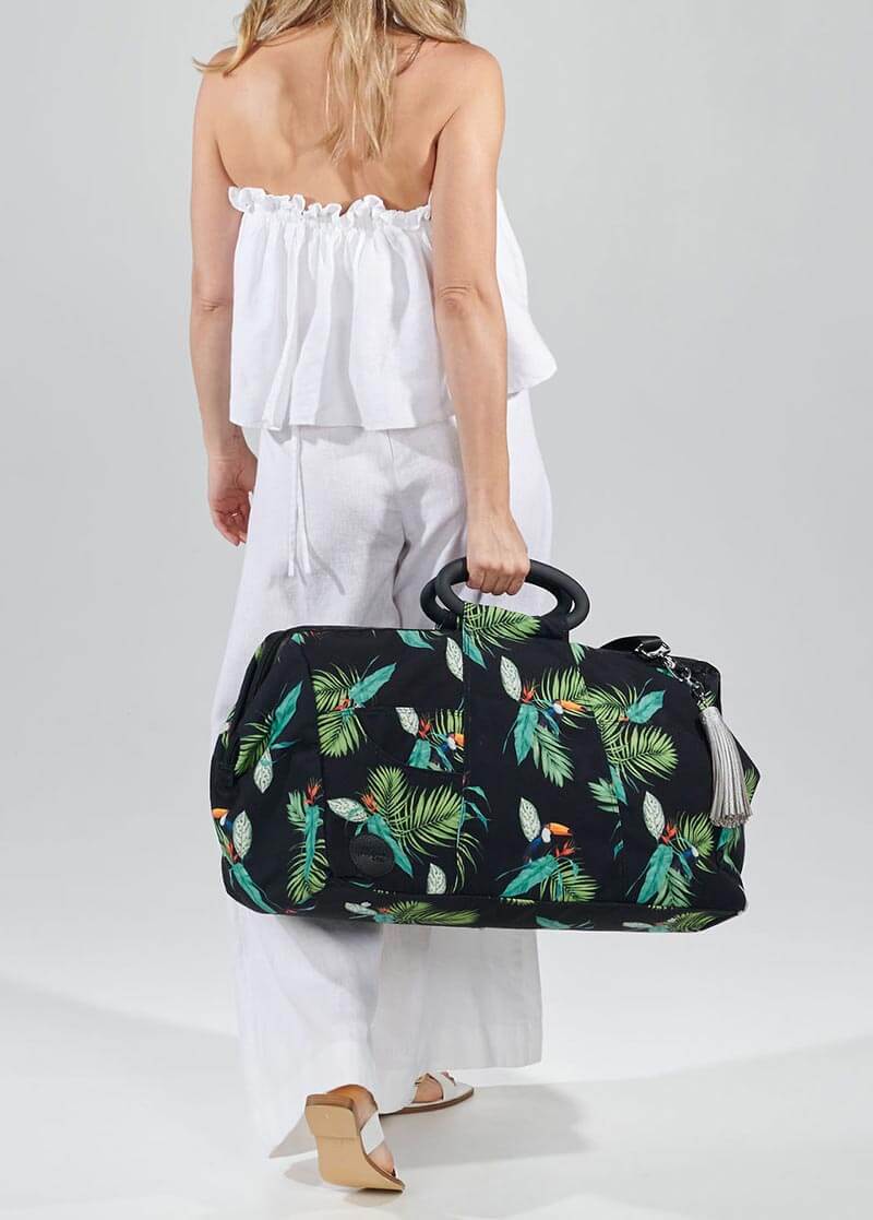 Toucan overnight bag in woman&#39;s hand