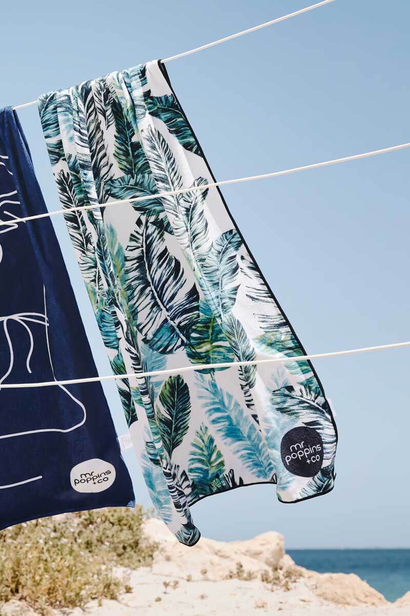 feather towel hanging on a fence